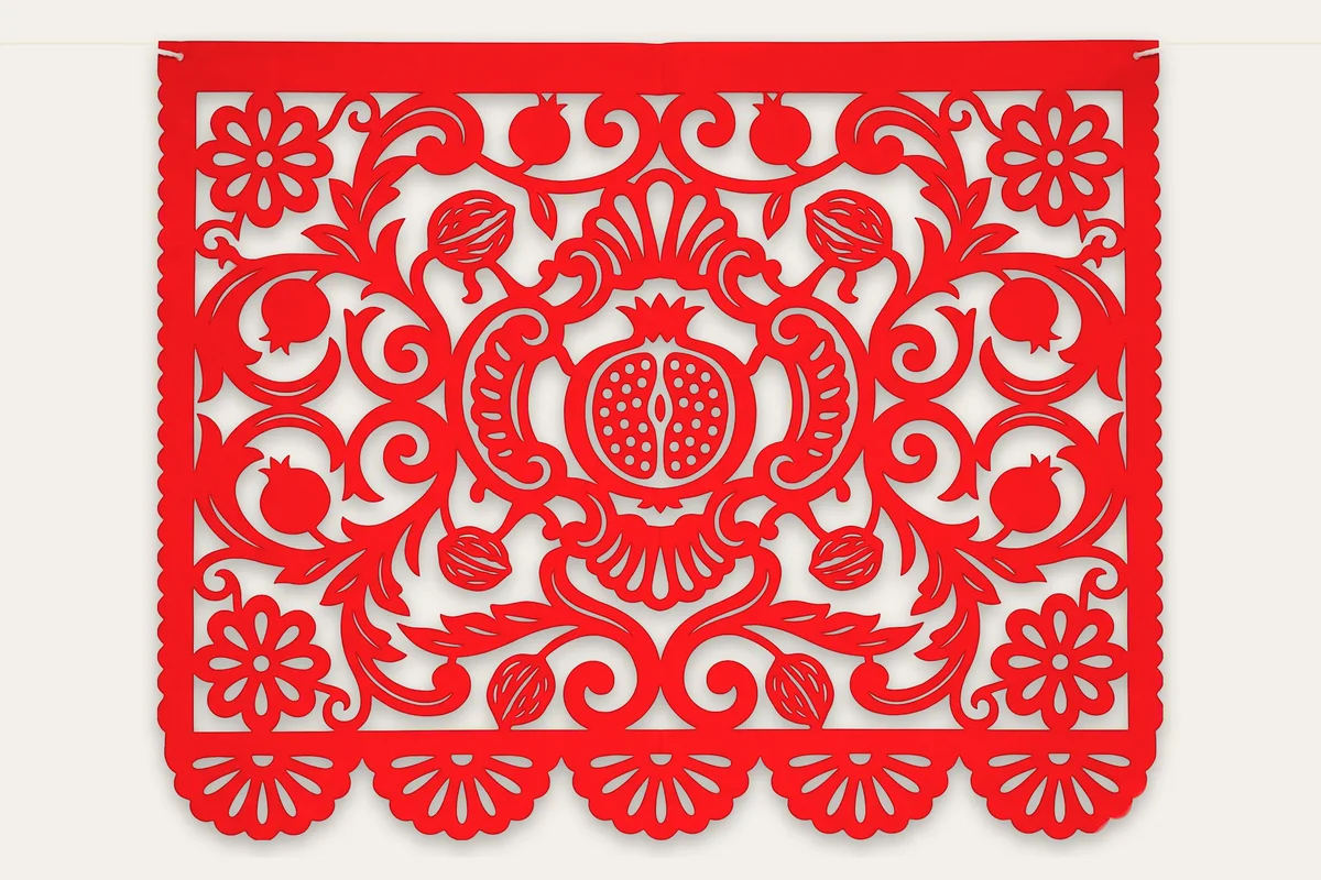 La pieza barroca de granada, acanto y nueces cortada en papel picado rojo granada