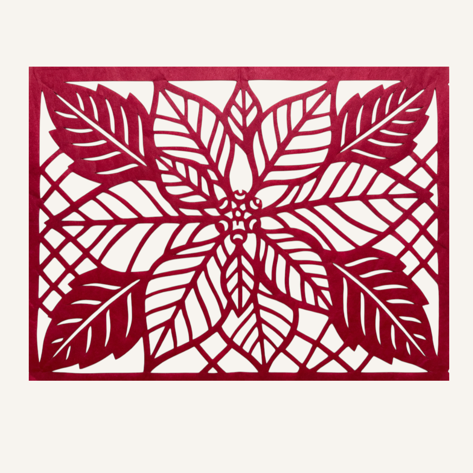 Papel picado artesanal con flor de nochebuena detallada, ideal para Navidad mexicana